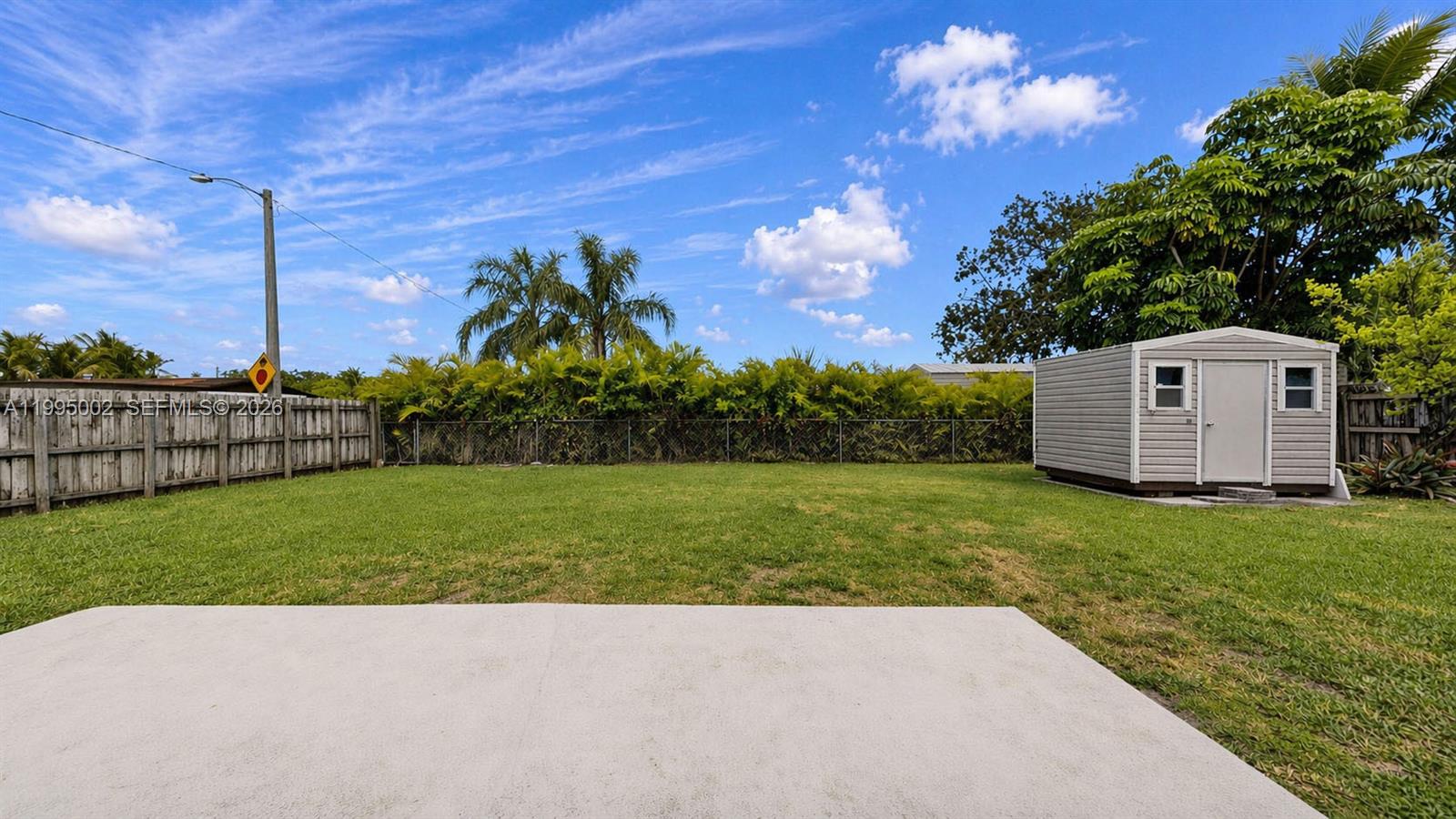 15305 Southwest 104th Avenue Miami, FL 33157 - Photo 12 of 46 a view of a backyard