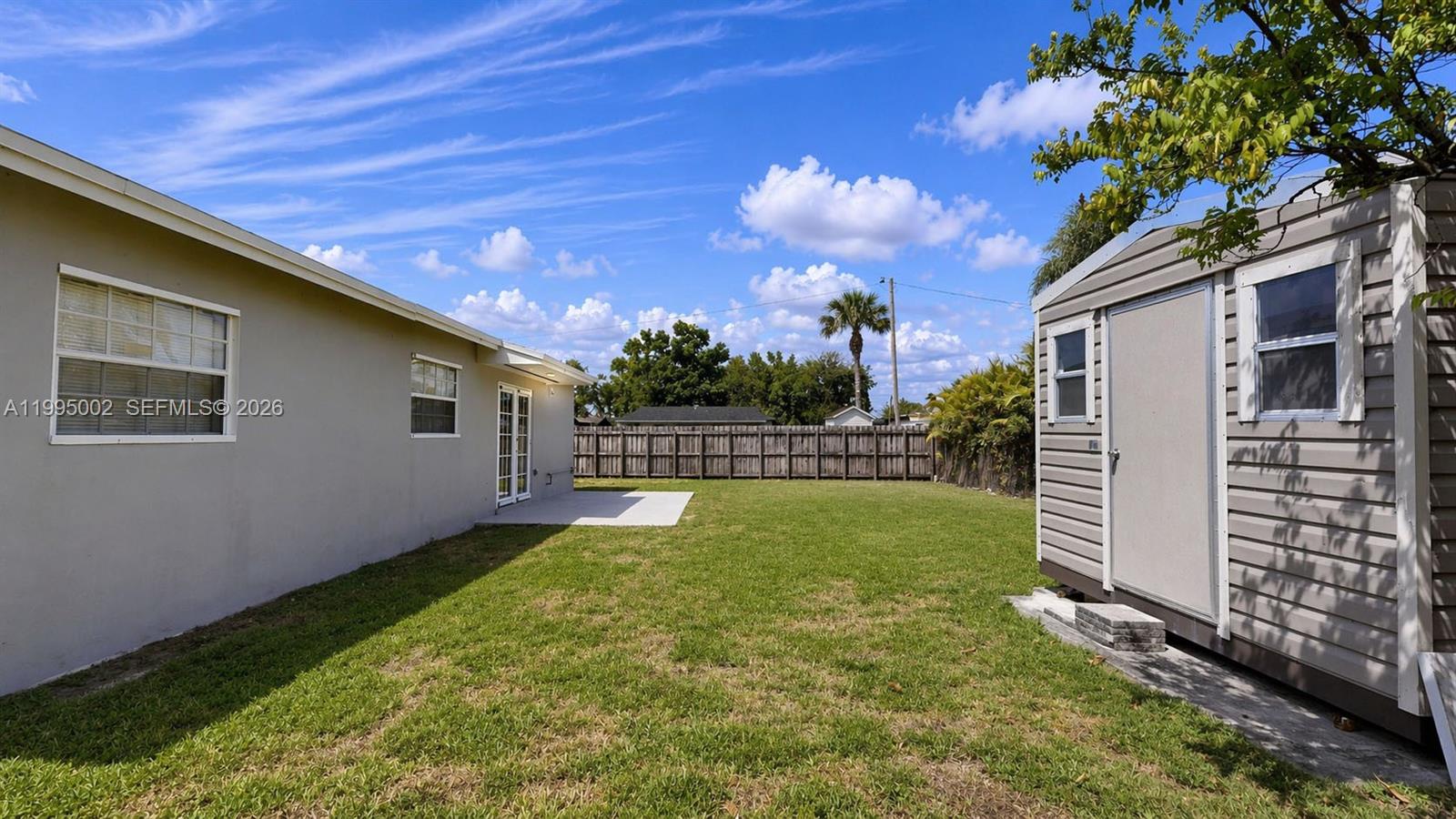 15305 Southwest 104th Avenue Miami, FL 33157 - Photo 13 of 46 a view of a backyard with a garden