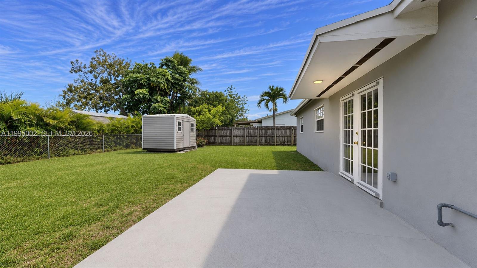 15305 Southwest 104th Avenue Miami, FL 33157 - Photo 14 of 46 a view of a house with a yard