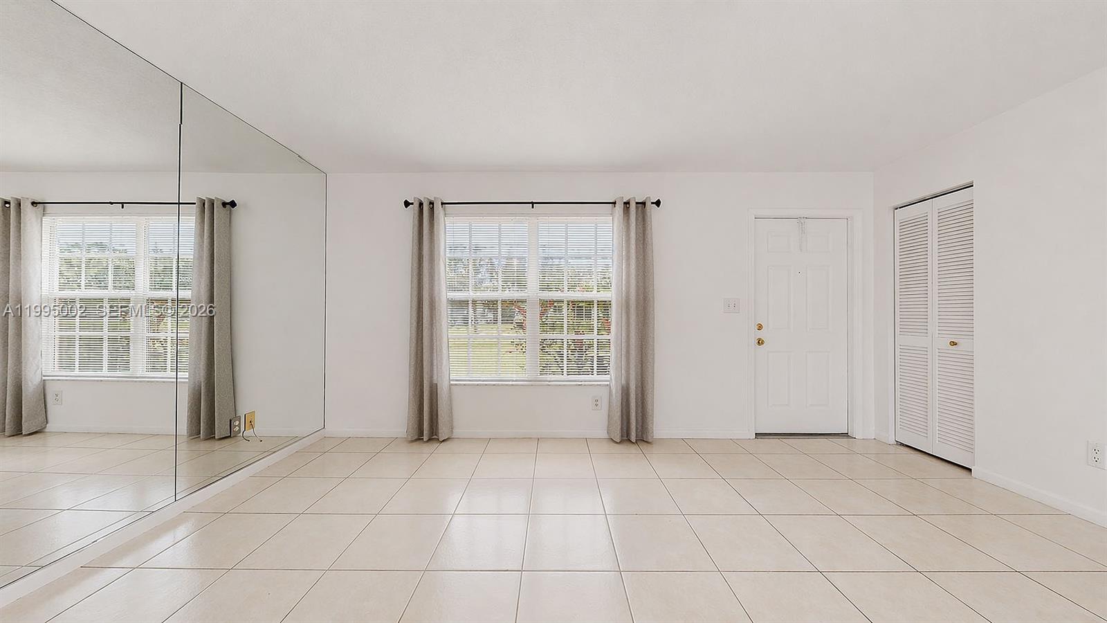15305 Southwest 104th Avenue Miami, FL 33157 - Photo 17 of 46 a view of an empty room with a window