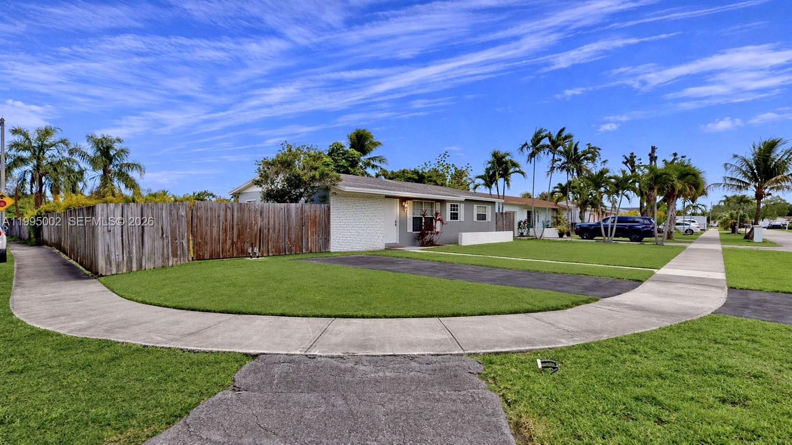 15305 Southwest 104th Avenue Miami, FL 33157 - Photo 2 of 46 front view of a house with a yard