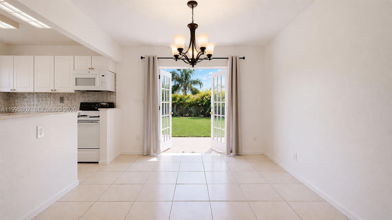 15305 Southwest 104th Avenue Miami, FL 33157 - Photo 21 of 46 a view of a kitchen with a sink and dishwasher kitchen view