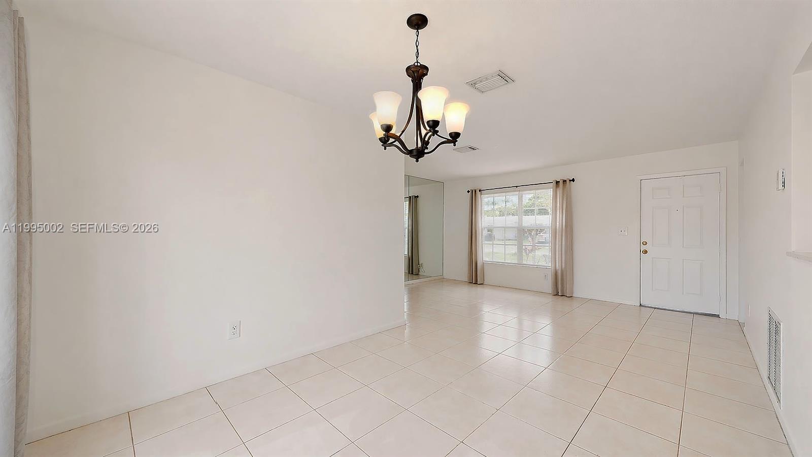 15305 Southwest 104th Avenue Miami, FL 33157 - Photo 22 of 46 a view of a chandelier in a room