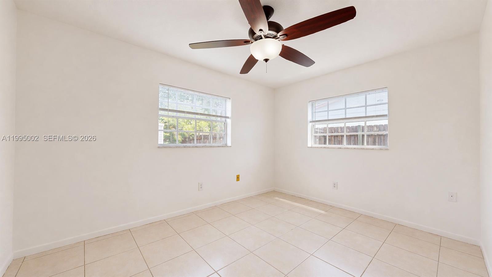 15305 Southwest 104th Avenue Miami, FL 33157 - Photo 36 of 46 a view of an empty room with a window