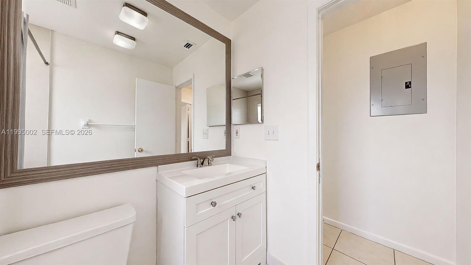 15305 Southwest 104th Avenue Miami, FL 33157 - Photo 38 of 46 a bathroom with a sink and a mirror