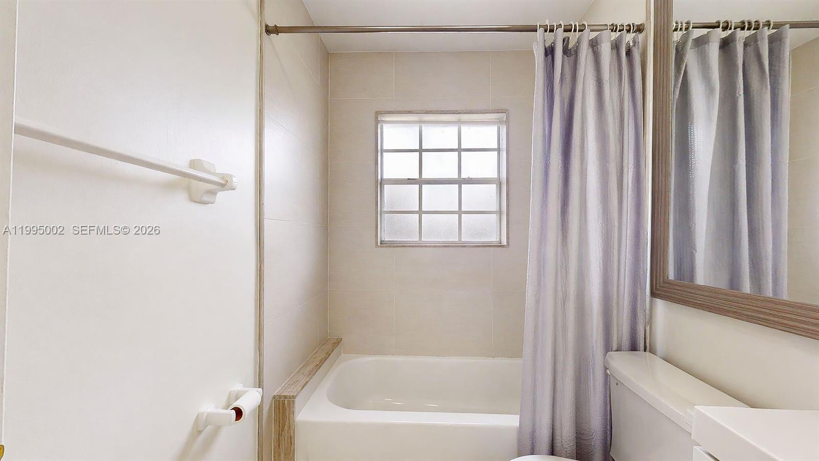 15305 Southwest 104th Avenue Miami, FL 33157 - Photo 40 of 46 a bathroom with a bathtub and a shower