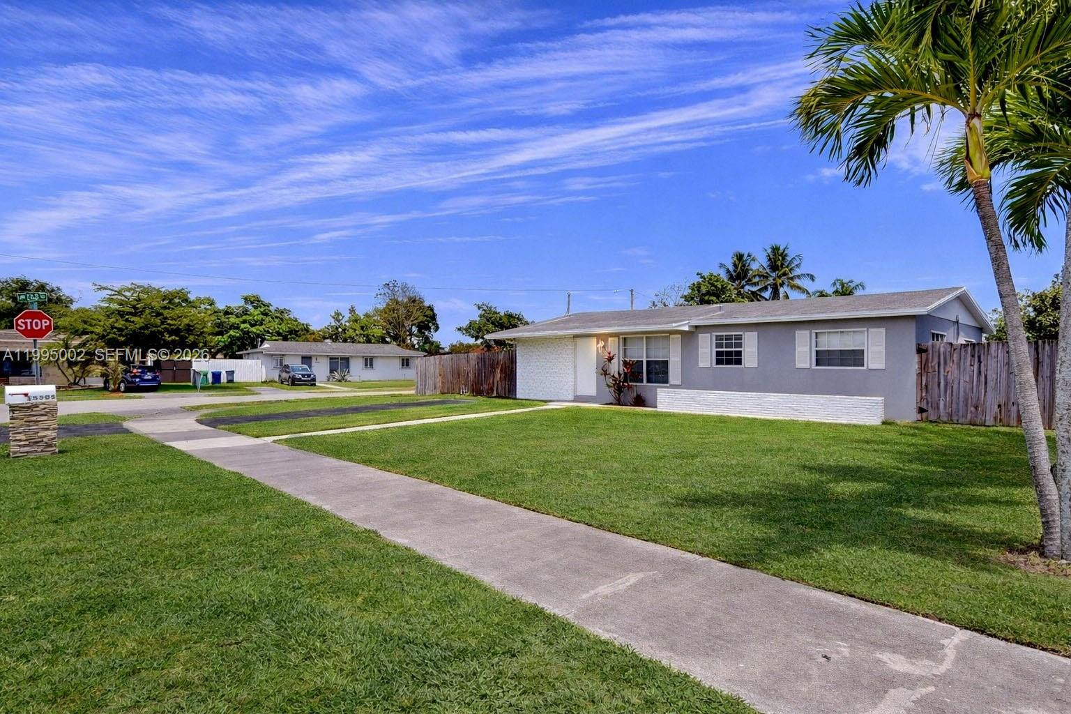 15305 Southwest 104th Avenue Miami, FL 33157 - Photo 4 of 46 a view of a house with a big yard