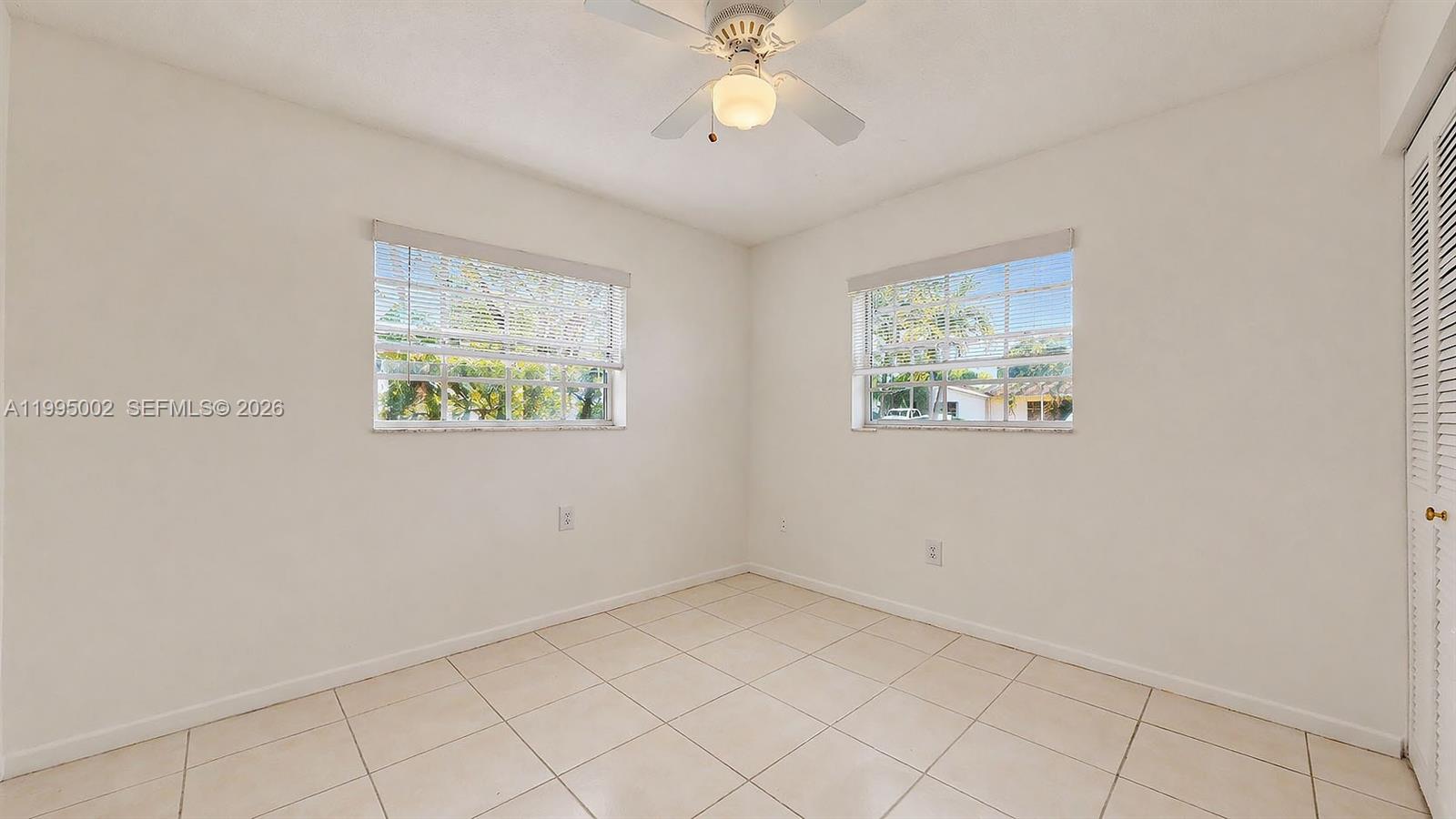 15305 Southwest 104th Avenue Miami, FL 33157 - Photo 42 of 46 a view of an empty room with a window