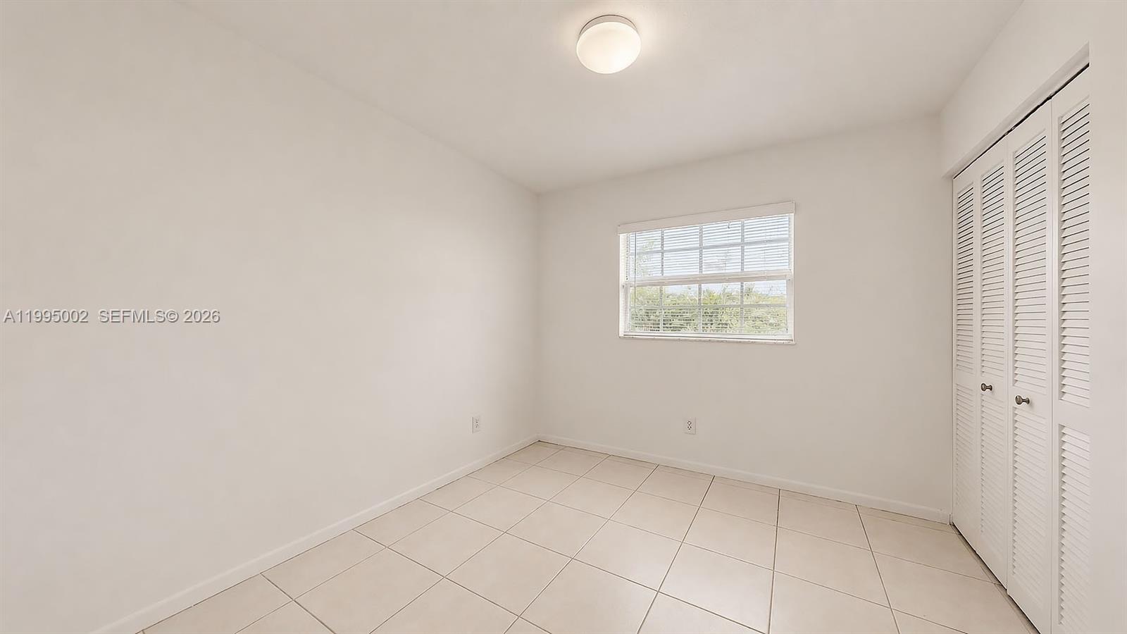 15305 Southwest 104th Avenue Miami, FL 33157 - Photo 45 of 46 an empty room with windows