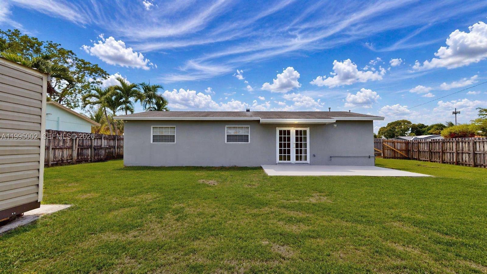 15305 Southwest 104th Avenue Miami, FL 33157 - Photo 6 of 46 a backyard of a house with lots of green space