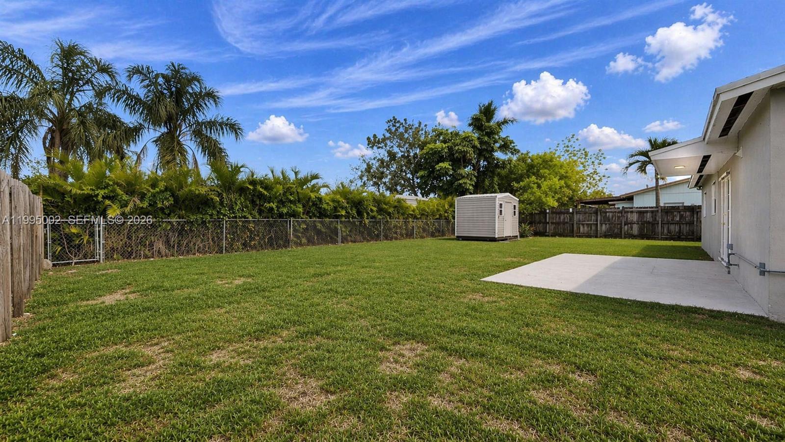 15305 Southwest 104th Avenue Miami, FL 33157 - Photo 9 of 46 a view of a yard