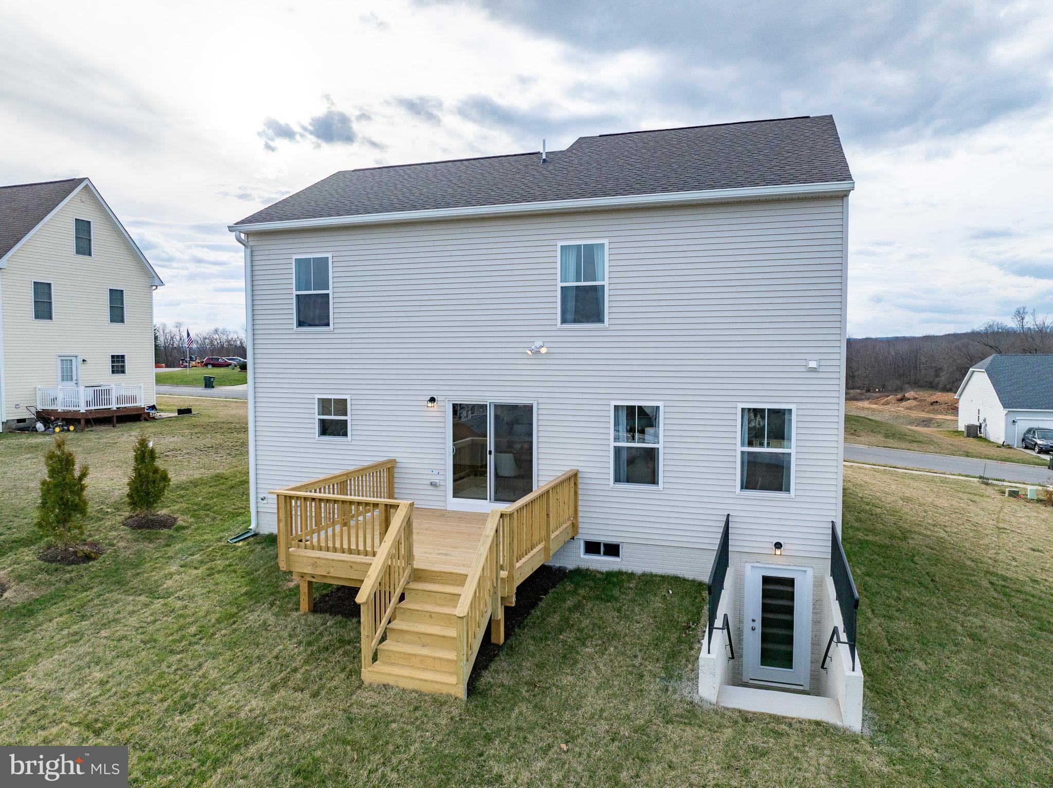 121 Indian Hills Road Locust Grove, VA 22508 - Photo 26 of 26 a view of a house with backyard and a chair