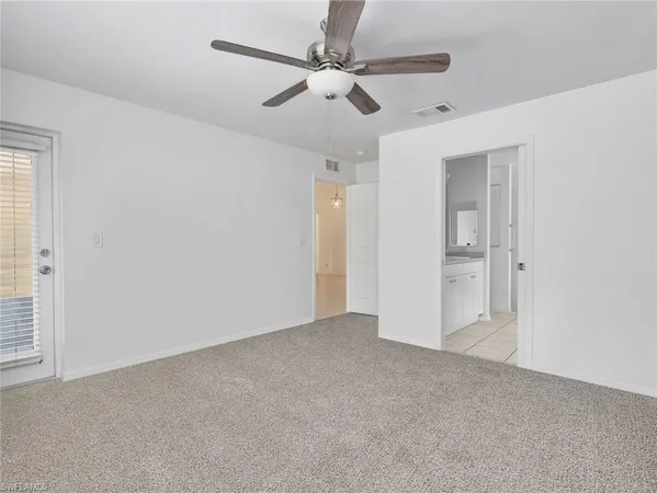 an empty room with fan