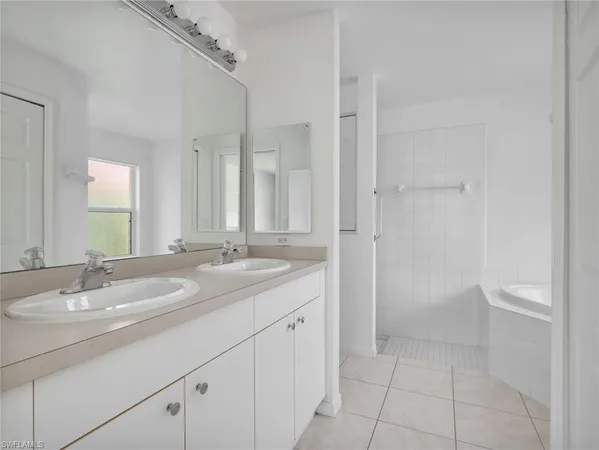 a bathroom with a granite countertop sink a toilet and a shower