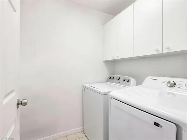 a view of storage and utility room with washer and dryer