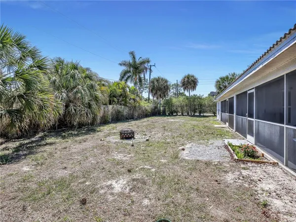 a backyard of a house with lots of green space