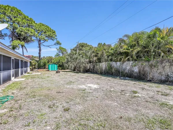 an aerial view of residential building and lake