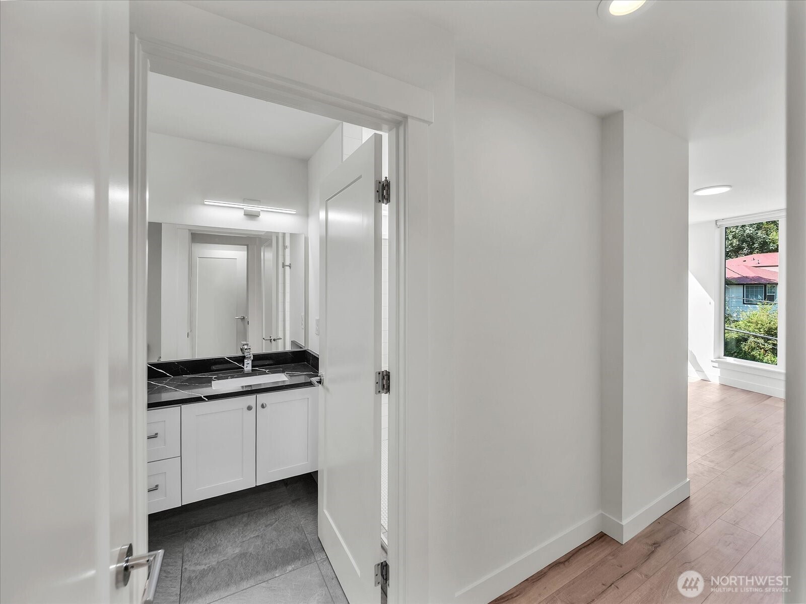 3628 14th Avenue South Seattle, WA 98144 - Photo 16 of 27 a bathroom with a double vanity sink and mirror