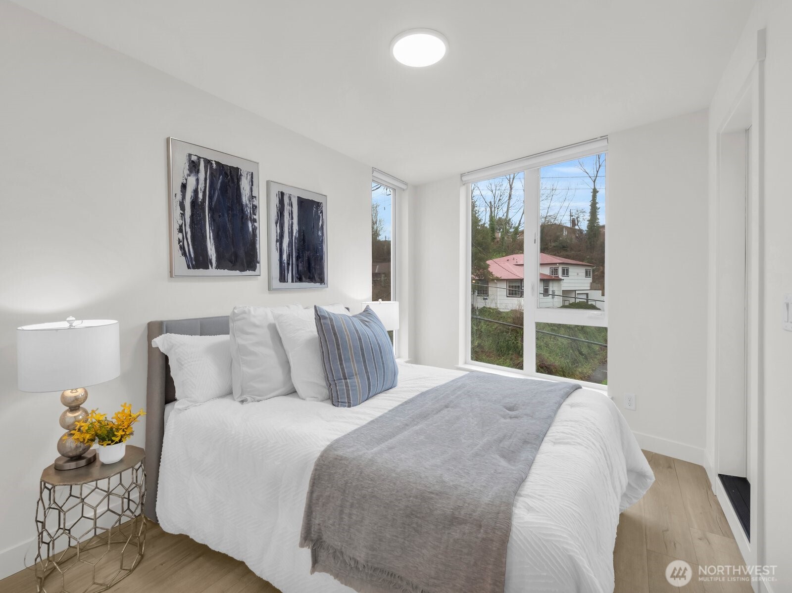 3628 14th Avenue South Seattle, WA 98144 - Photo 18 of 27 a bedroom with a bed and window