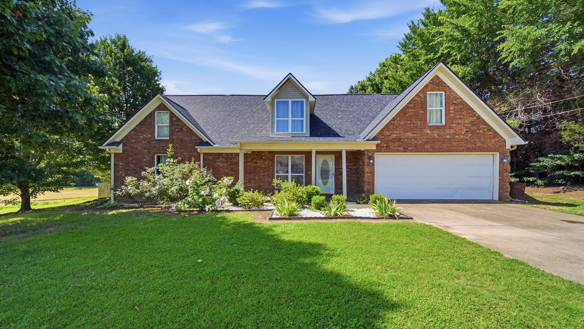 217 Rae Drive Munford, TN 38058 - Photo 1 of 40 Brick veneer exterior with a gabled roofline