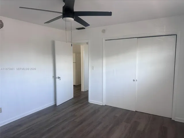 a view of an empty room with a fan