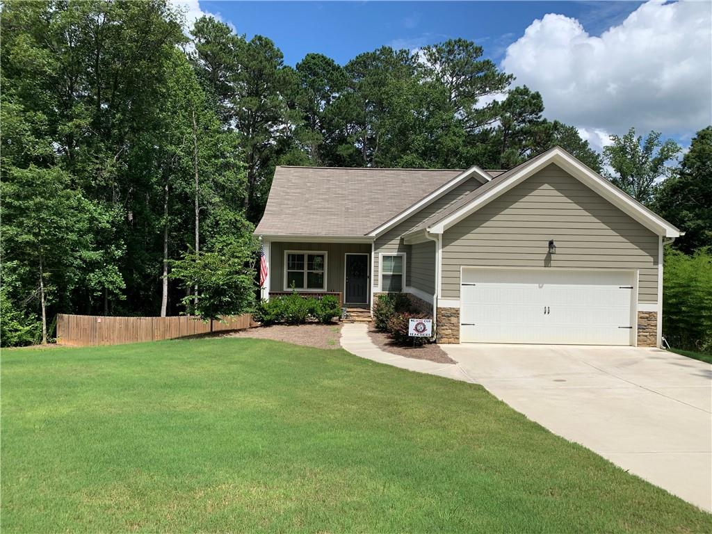 201 Jane Harris Road Dallas, GA 30157 - Photo 1 of 1 a view of a house with a backyard and sitting area