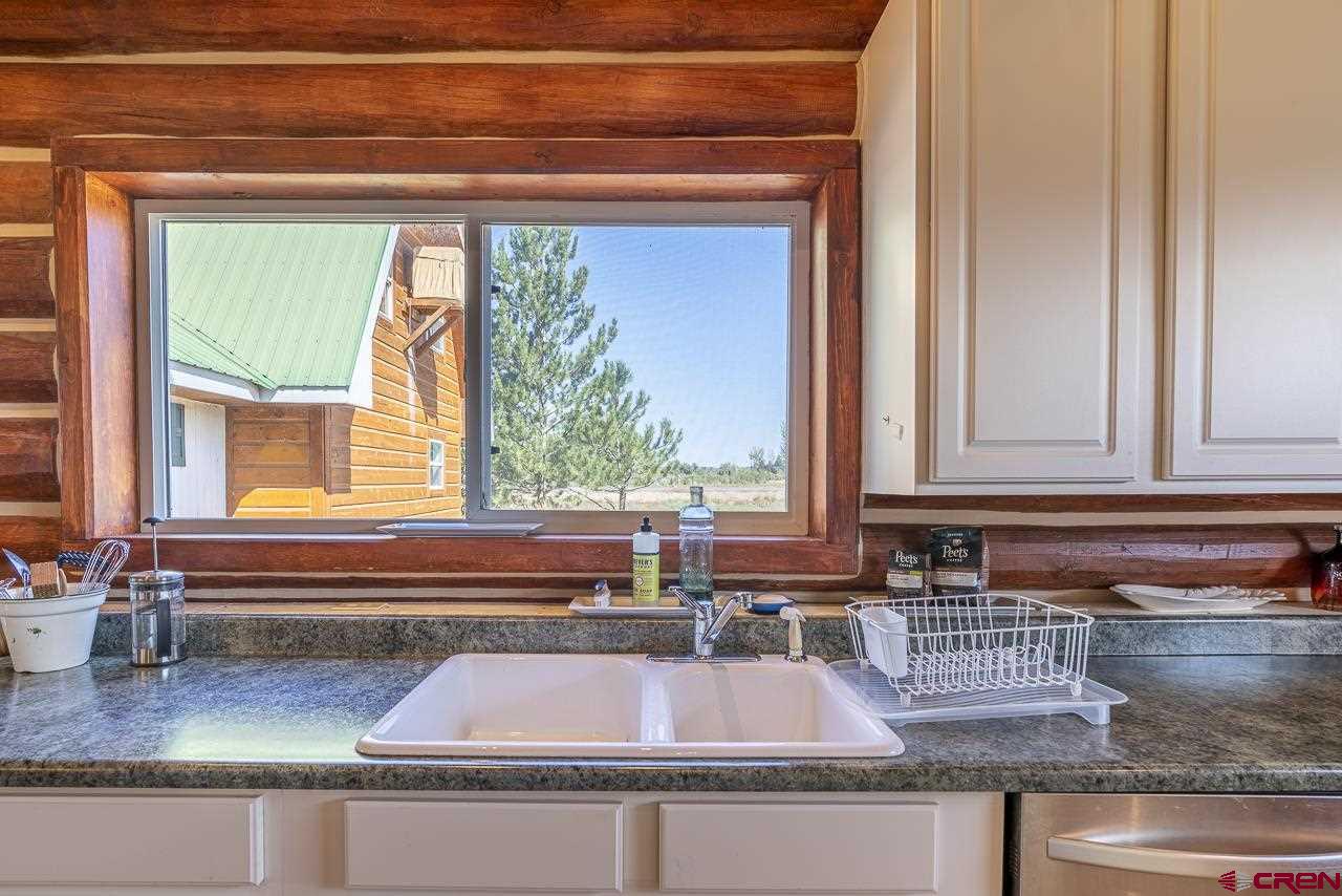 25558 Rd N 6 Loop Cortez, CO 81321 - Photo 11 of 30 a kitchen with a sink and a window
