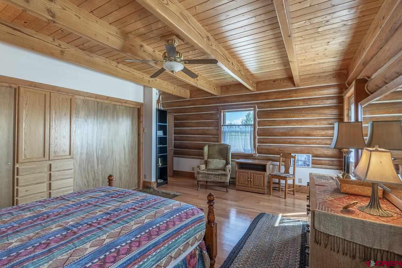 25558 Rd N 6 Loop Cortez, CO 81321 - Photo 12 of 30 a bedroom with furniture and a window