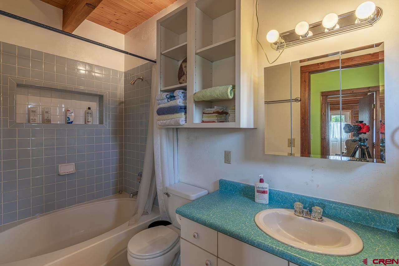 25558 Rd N 6 Loop Cortez, CO 81321 - Photo 17 of 30 a bathroom with a sink a toilet and shower