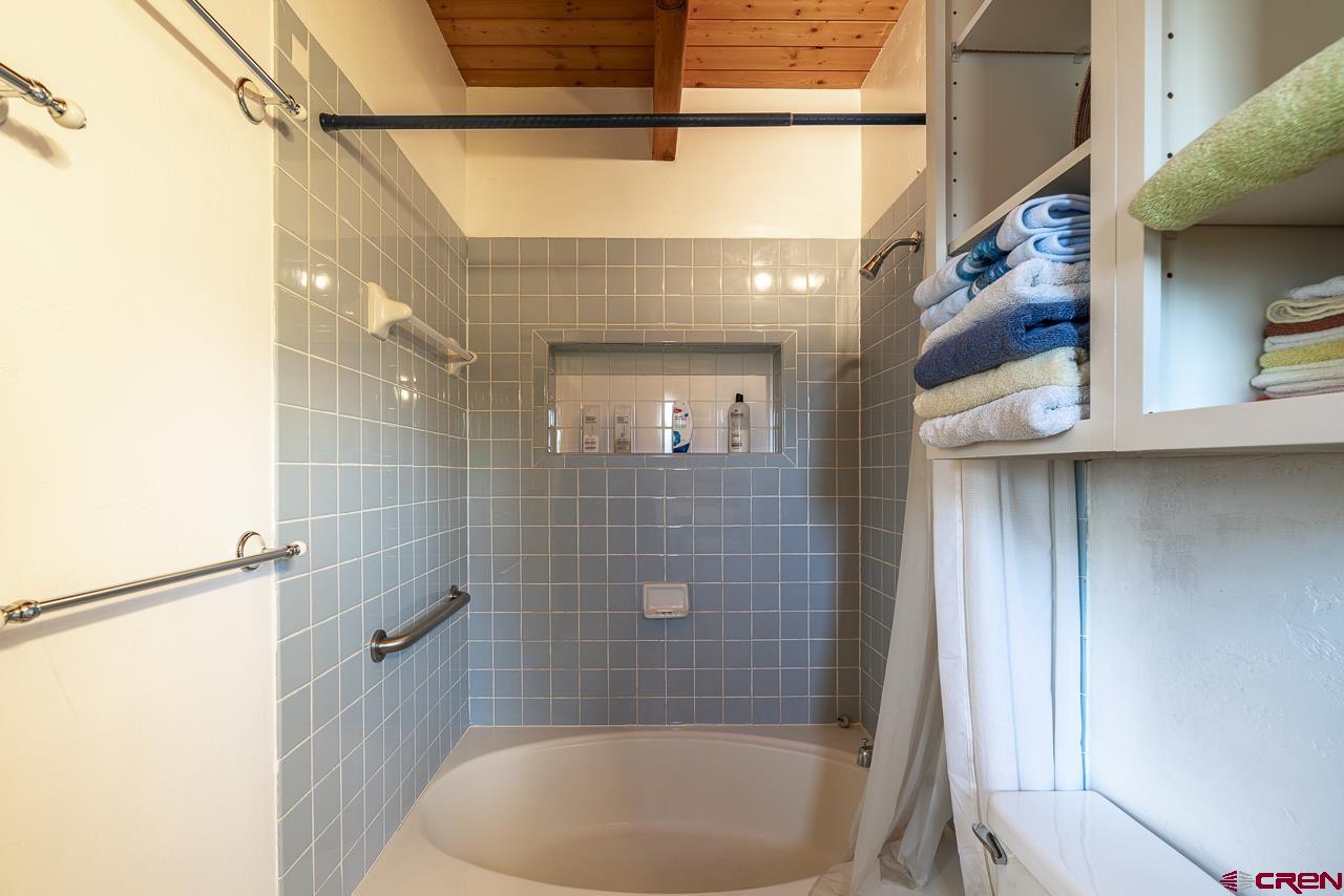25558 Rd N 6 Loop Cortez, CO 81321 - Photo 18 of 30 a bathroom with a bathtub and shower