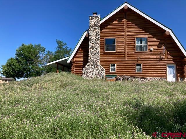 25558 Rd N 6 Loop Cortez, CO 81321 - Photo 28 of 30 a front view of a house with a yard