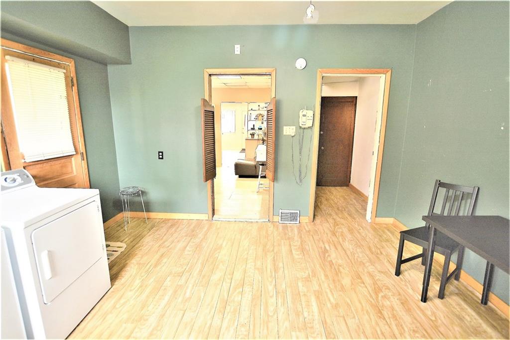 2517 Mt Troy Road Pittsburgh, PA 15212 - Photo 28 of 40 Room taken from sink area looking into the wash station and to the far right the first door leads to a small area with another door to the basement and to the left of that door are the stairs to the second floor.