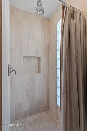 a bathroom with a shower and a tub