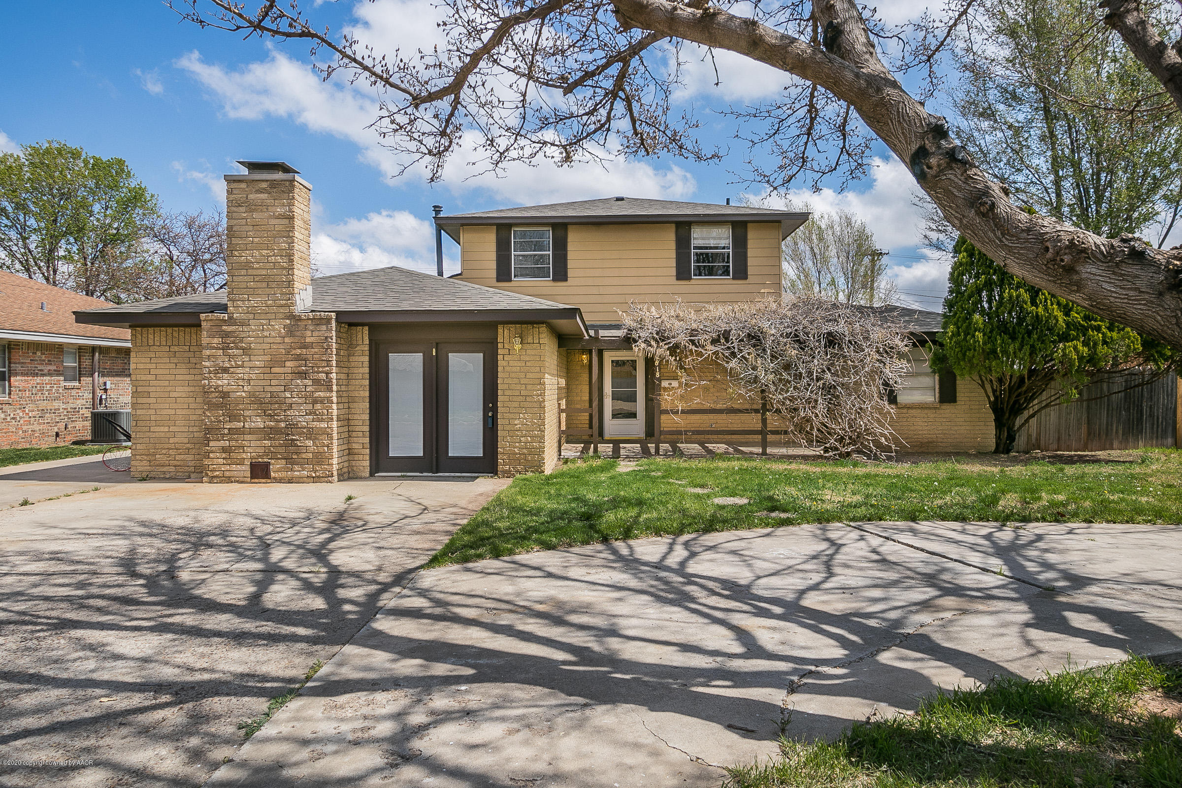 2818 Porter Drive Amarillo, TX 79110 - Photo 1 of 24 front view of a house with a yard