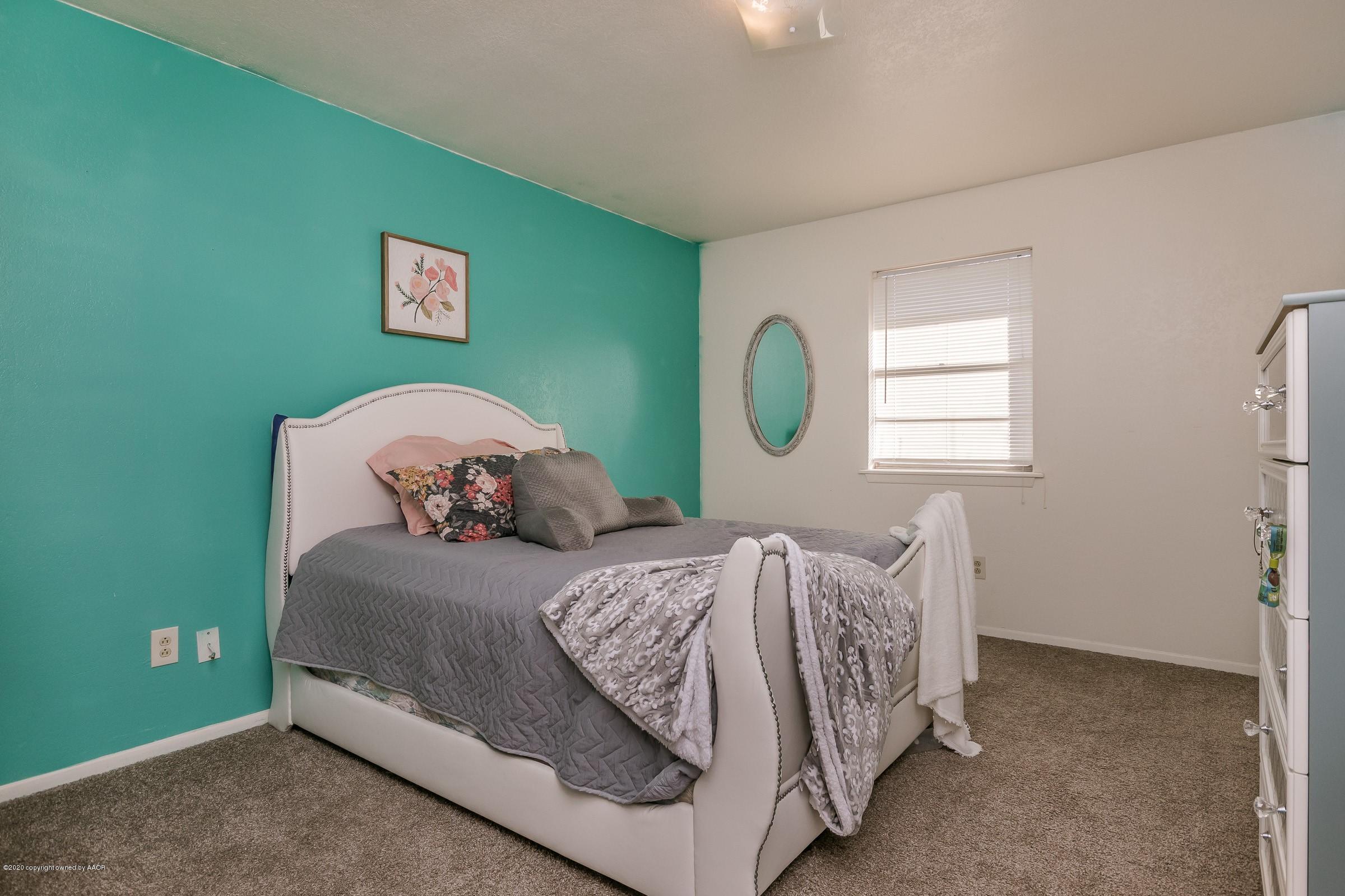 2818 Porter Drive Amarillo, TX 79110 - Photo 14 of 24 a bedroom with a bed and window