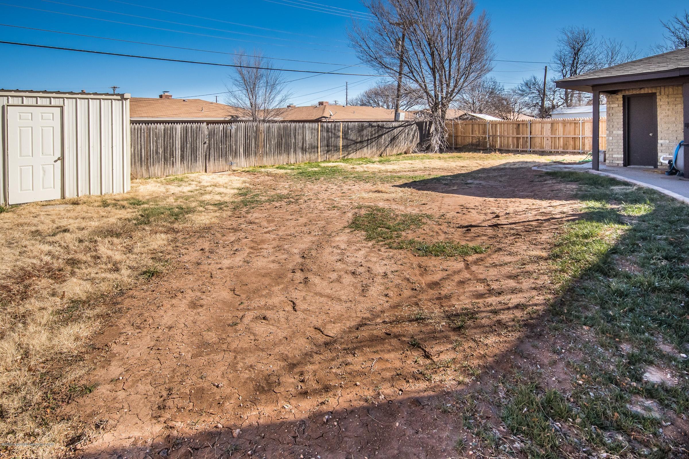 2818 Porter Drive Amarillo, TX 79110 - Photo 22 of 24 a backyard of a house with shaded area