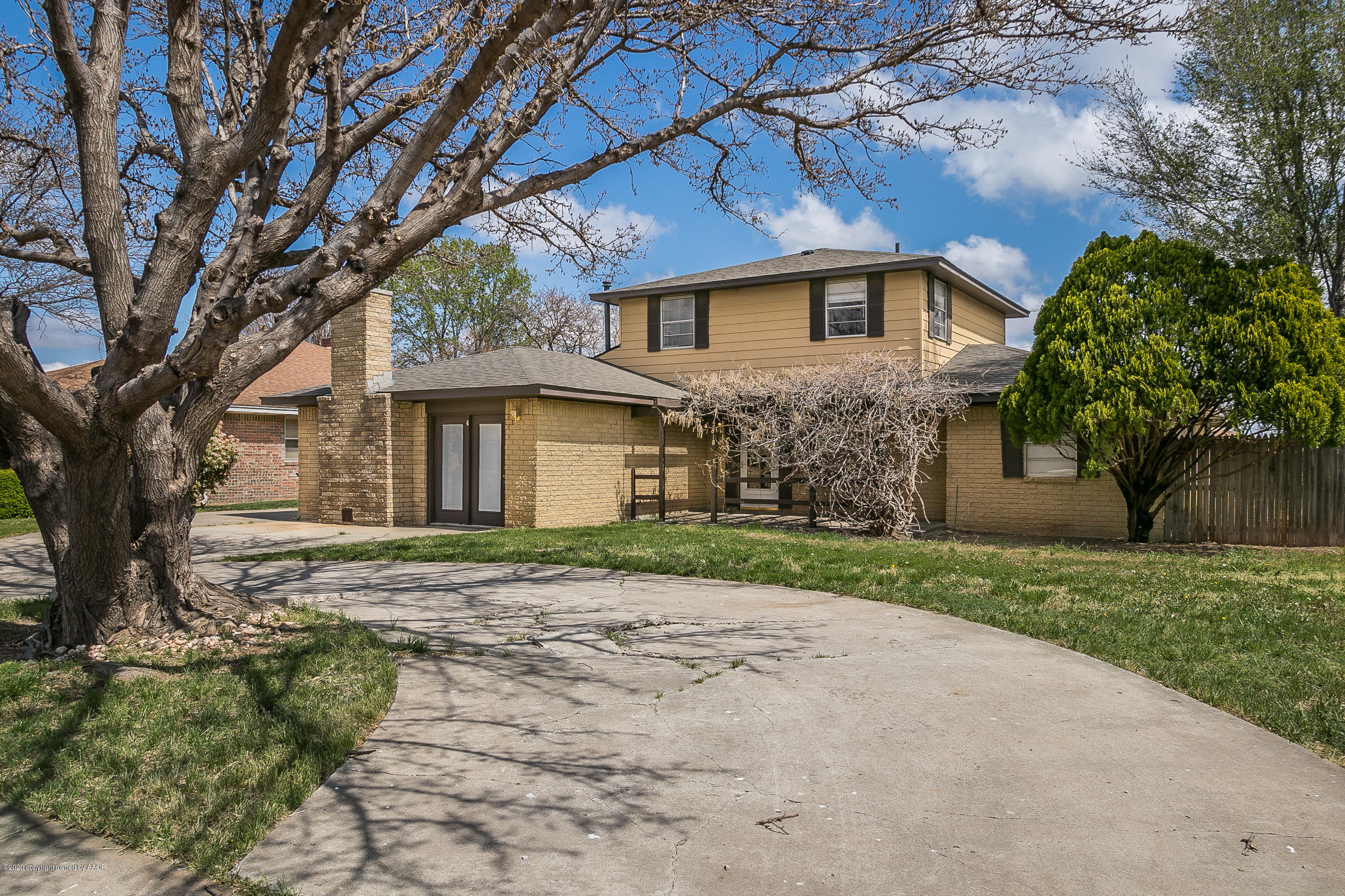 2818 Porter Drive Amarillo, TX 79110 - Photo 24 of 24 a front view of a house with a garden