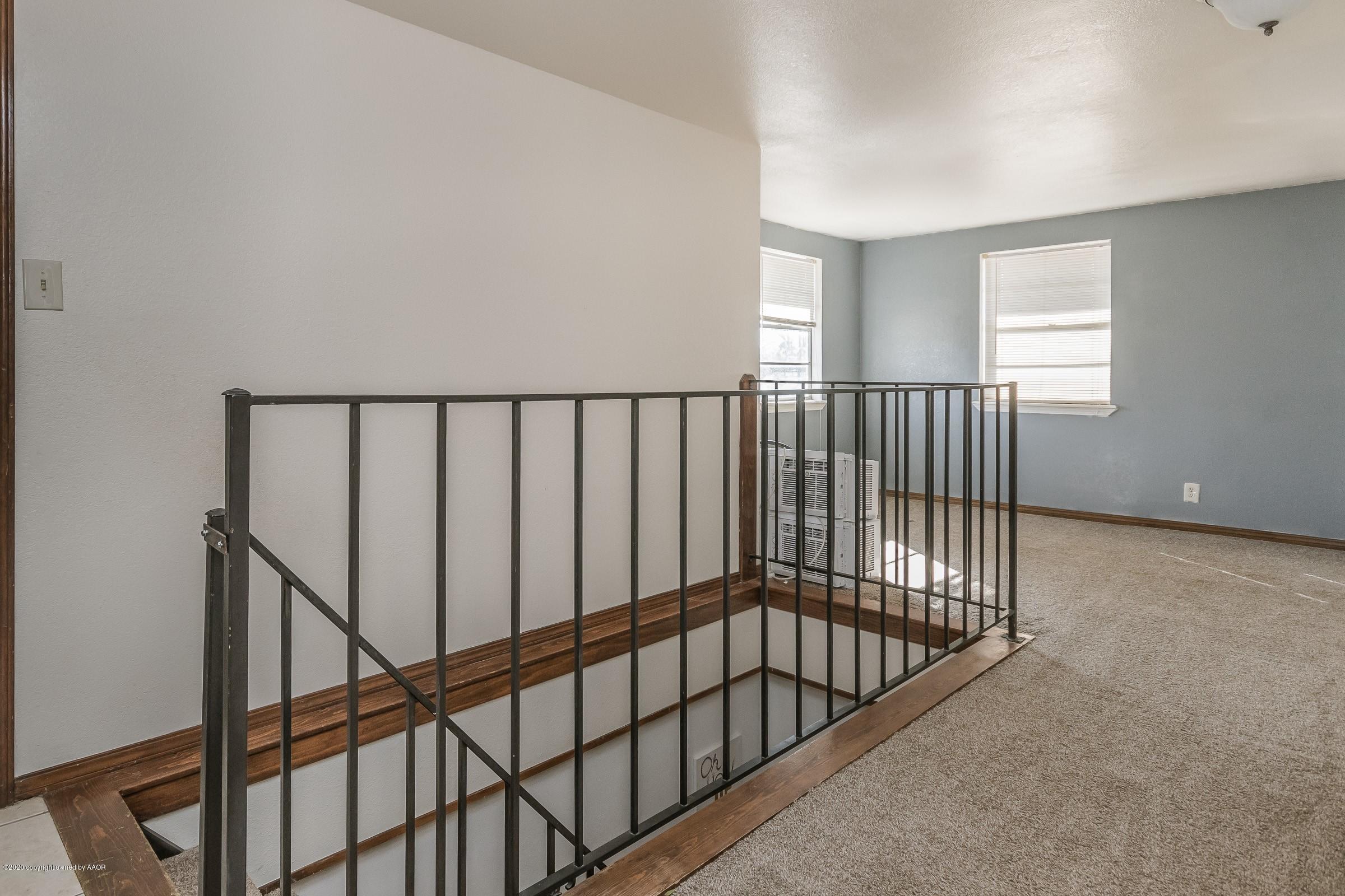 2818 Porter Drive Amarillo, TX 79110 - Photo 5 of 24 a view of staircase with railing and a window