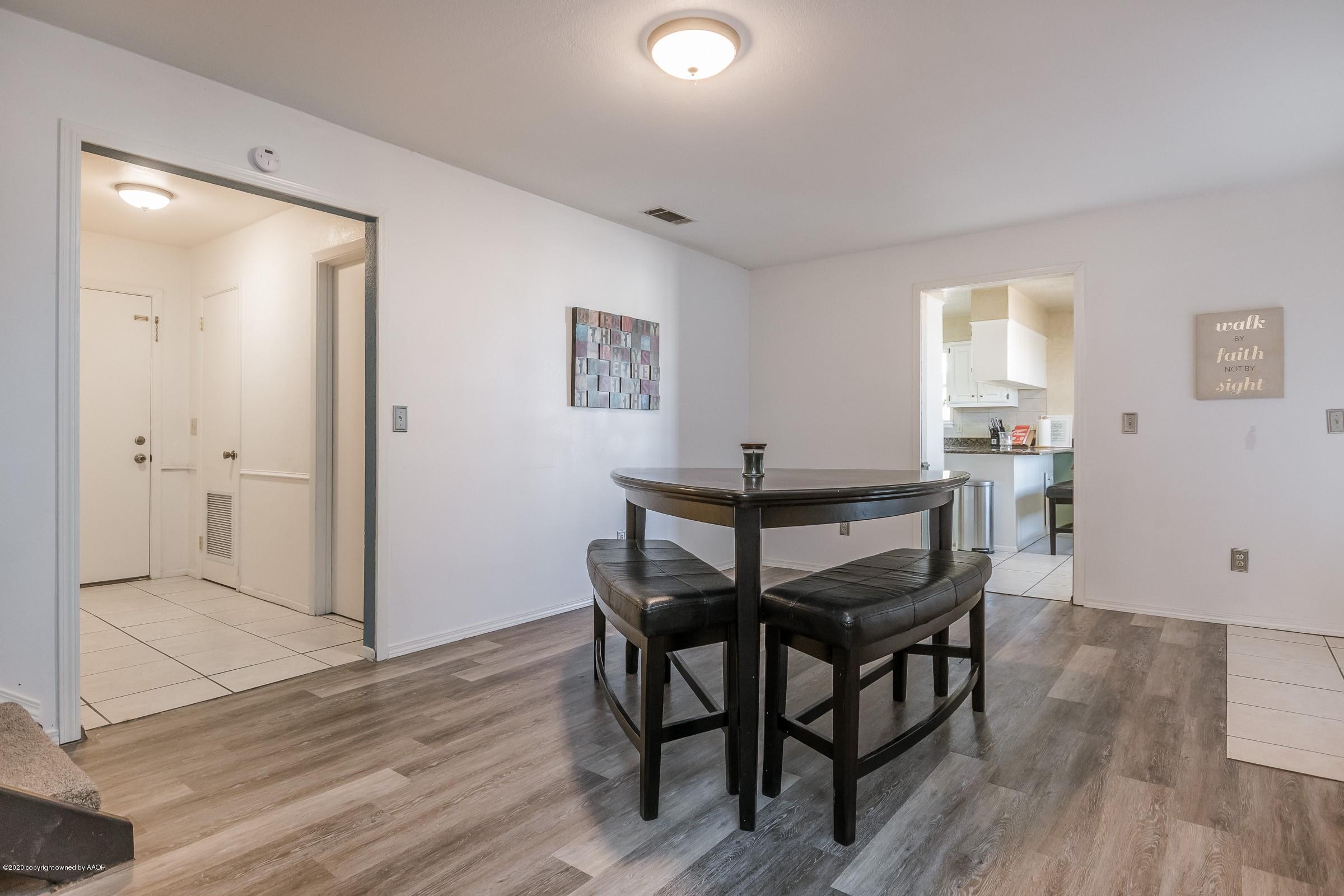 2818 Porter Drive Amarillo, TX 79110 - Photo 6 of 24 a view of a dining room with furniture and wooden floor