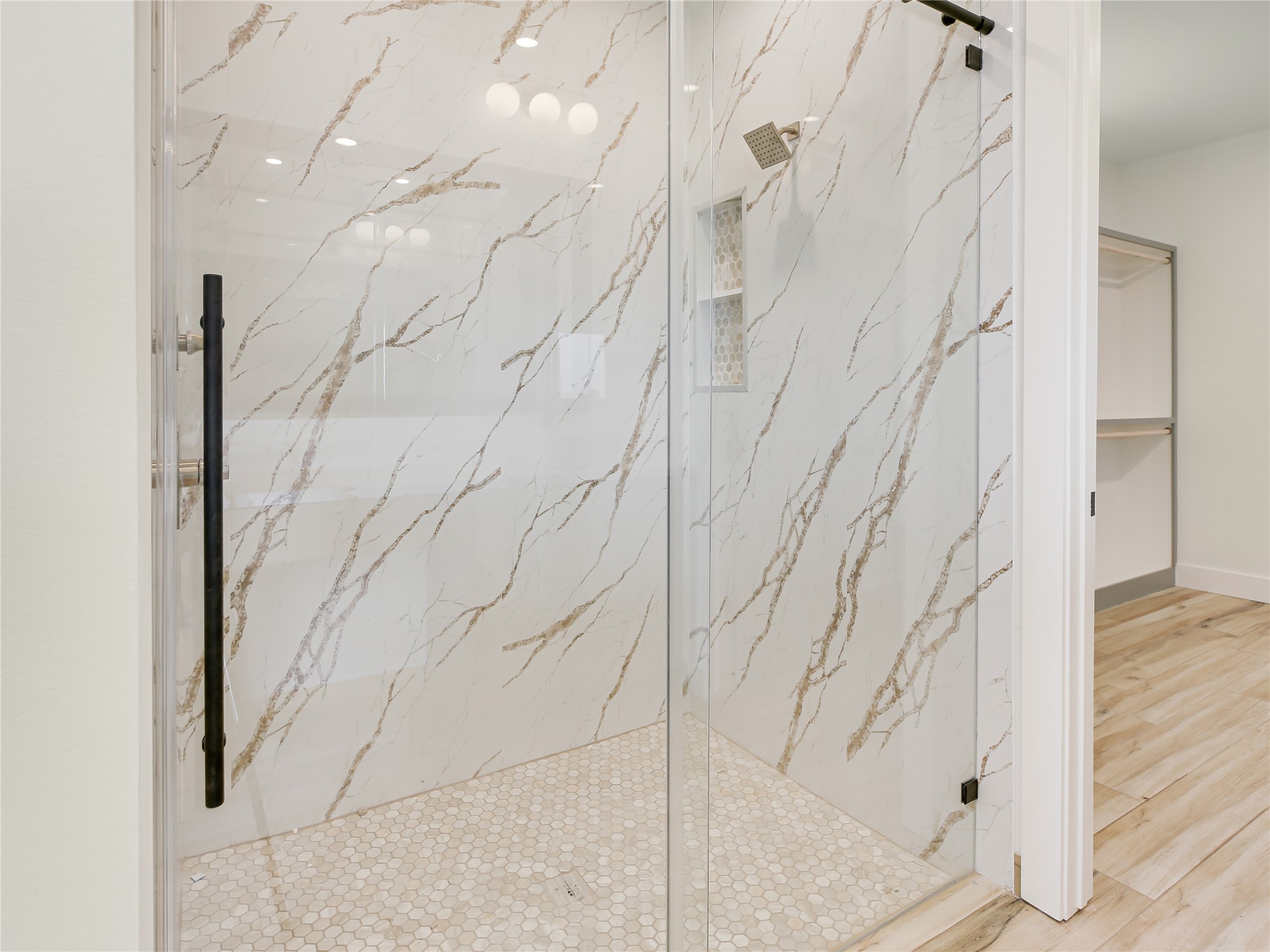 643 Chuckwagon Trail Angleton, TX 77515 - Photo 23 of 37 Oversize shower with 8-foot porcelain slab walls, customized shower glass doors.