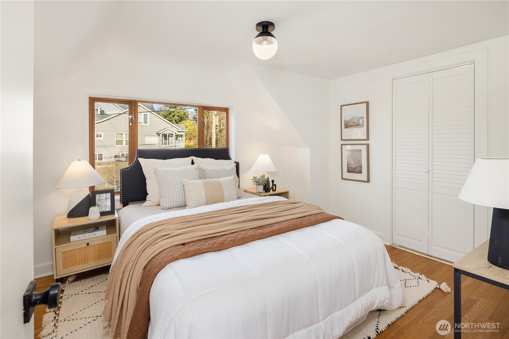 7920 5th Avenue Northeast Seattle, WA 98115 - Photo 21 of 31 a bedroom with bed and window