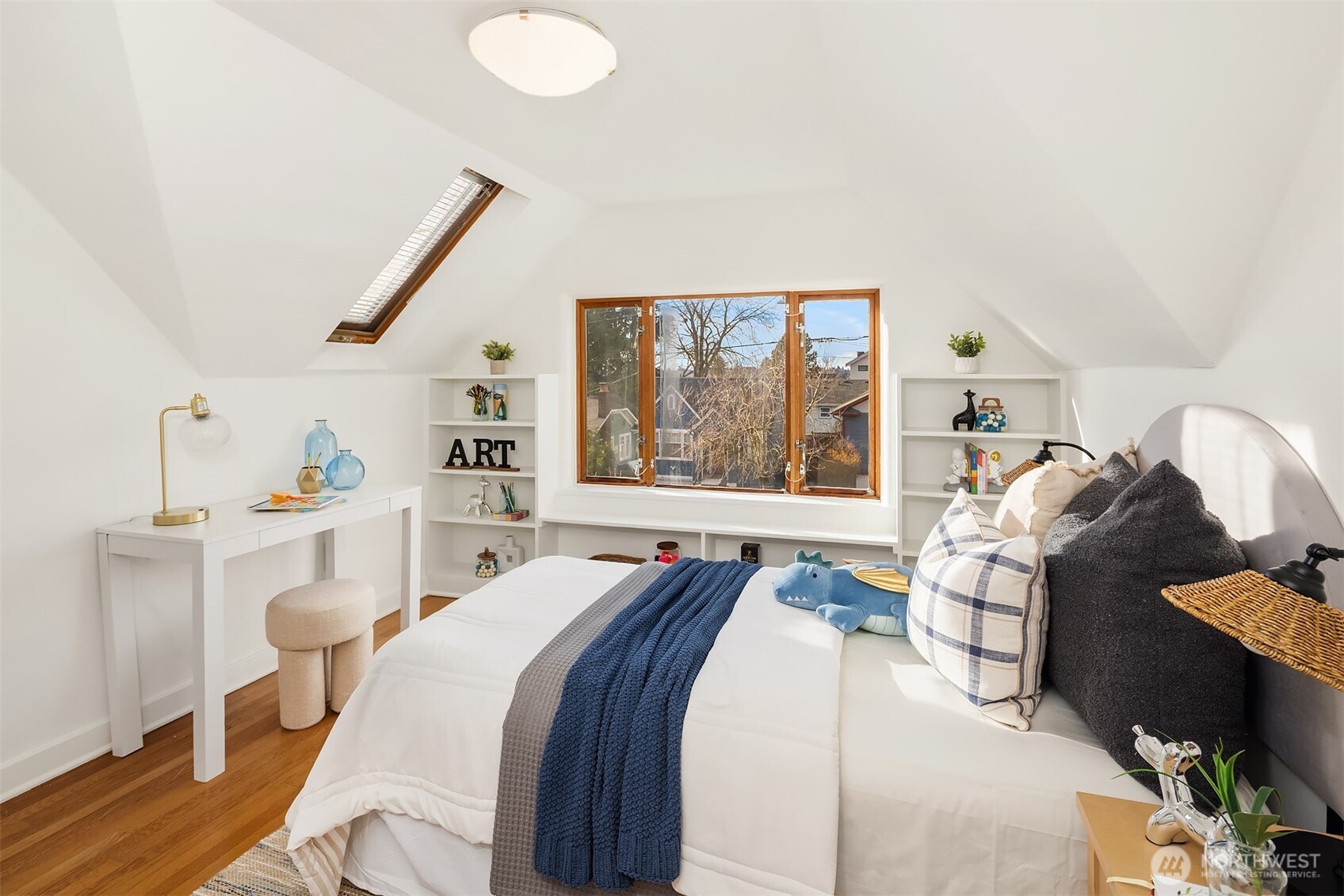 7920 5th Avenue Northeast Seattle, WA 98115 - Photo 22 of 31 a bed room with a bed and a large window