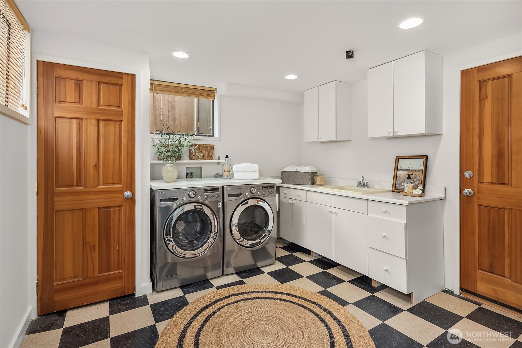 7920 5th Avenue Northeast Seattle, WA 98115 - Photo 27 of 31 a utility room with sink dryer and washer