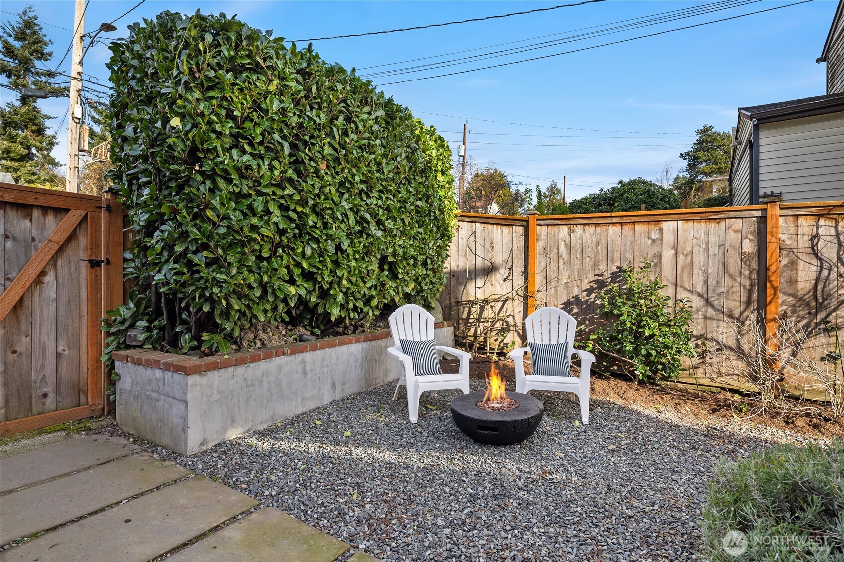 7920 5th Avenue Northeast Seattle, WA 98115 - Photo 29 of 31 a view of a terrace with chairs and potted plants