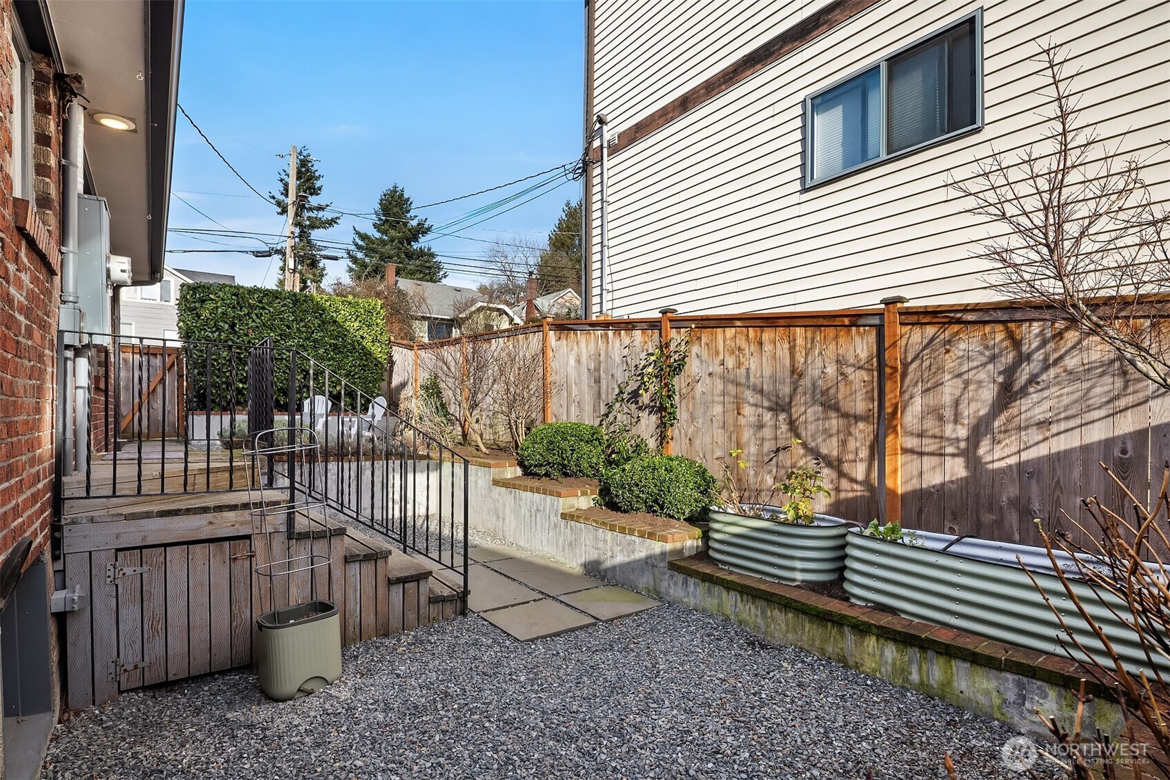 7920 5th Avenue Northeast Seattle, WA 98115 - Photo 30 of 31 a view of a house with a bench in patio