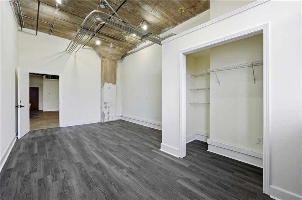 505 Whitehall Street Southwest, Unit 101 Atlanta, GA 30303 - Photo 13 of 31 a view of empty room with wooden floor