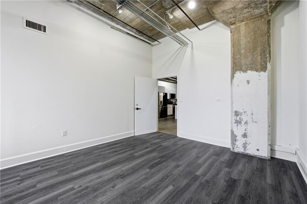 505 Whitehall Street Southwest, Unit 101 Atlanta, GA 30303 - Photo 14 of 31 a view of empty room with wooden floor