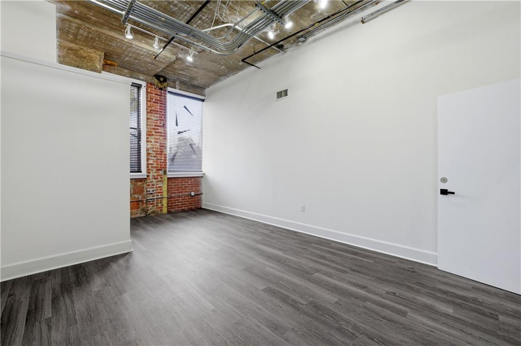 505 Whitehall Street Southwest, Unit 101 Atlanta, GA 30303 - Photo 15 of 31 a view of room with wooden floor