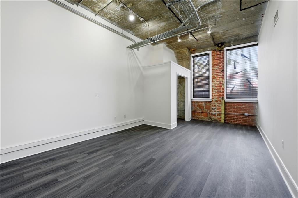 505 Whitehall Street Southwest, Unit 101 Atlanta, GA 30303 - Photo 16 of 31 a view of a room with wooden floor