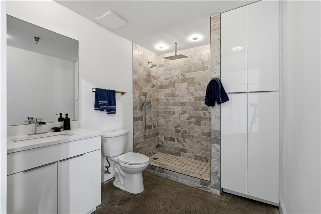 505 Whitehall Street Southwest, Unit 101 Atlanta, GA 30303 - Photo 17 of 31 a bathroom with a sink a toilet and shower